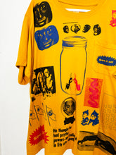 Load image into Gallery viewer, PRIMITIVE WITNESS COLLAGE ON MUSTARD POCKET T-SHIRT